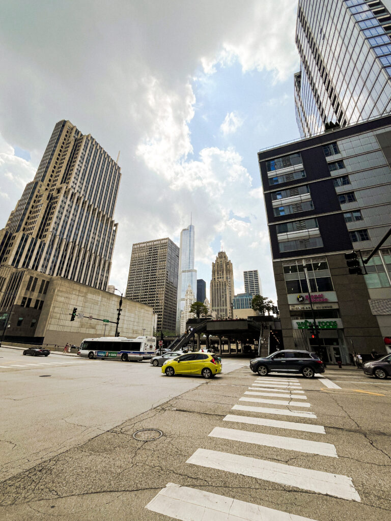 Street view of a crosswalk and skyscrapers